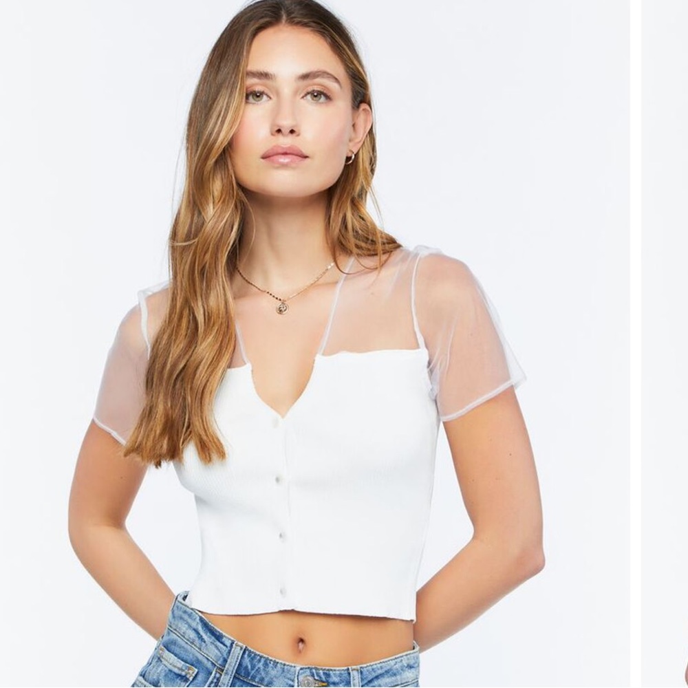 NWT A white ribbed sweater-knit top featuring a partial sheer neckline.